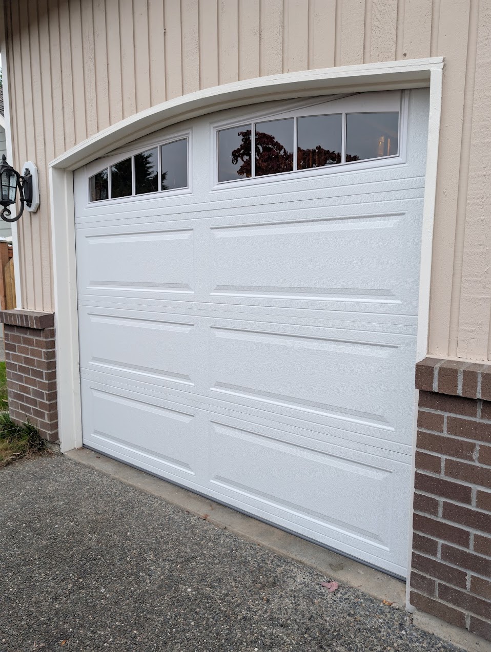 White garage door with arch top and windows installed in Renton, WA