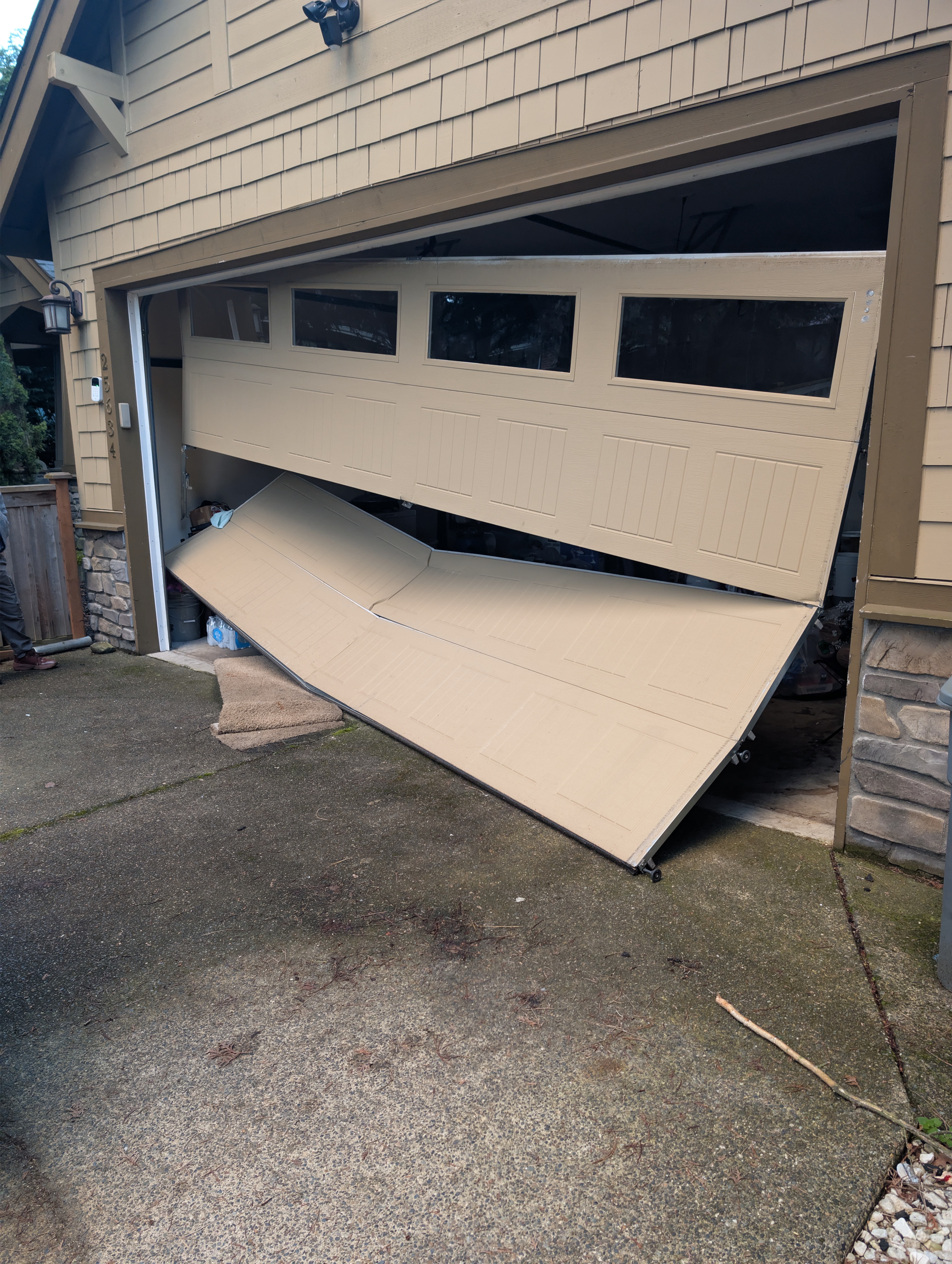 Emergency garage door repair — buckled door replaced same day in Seattle, WA