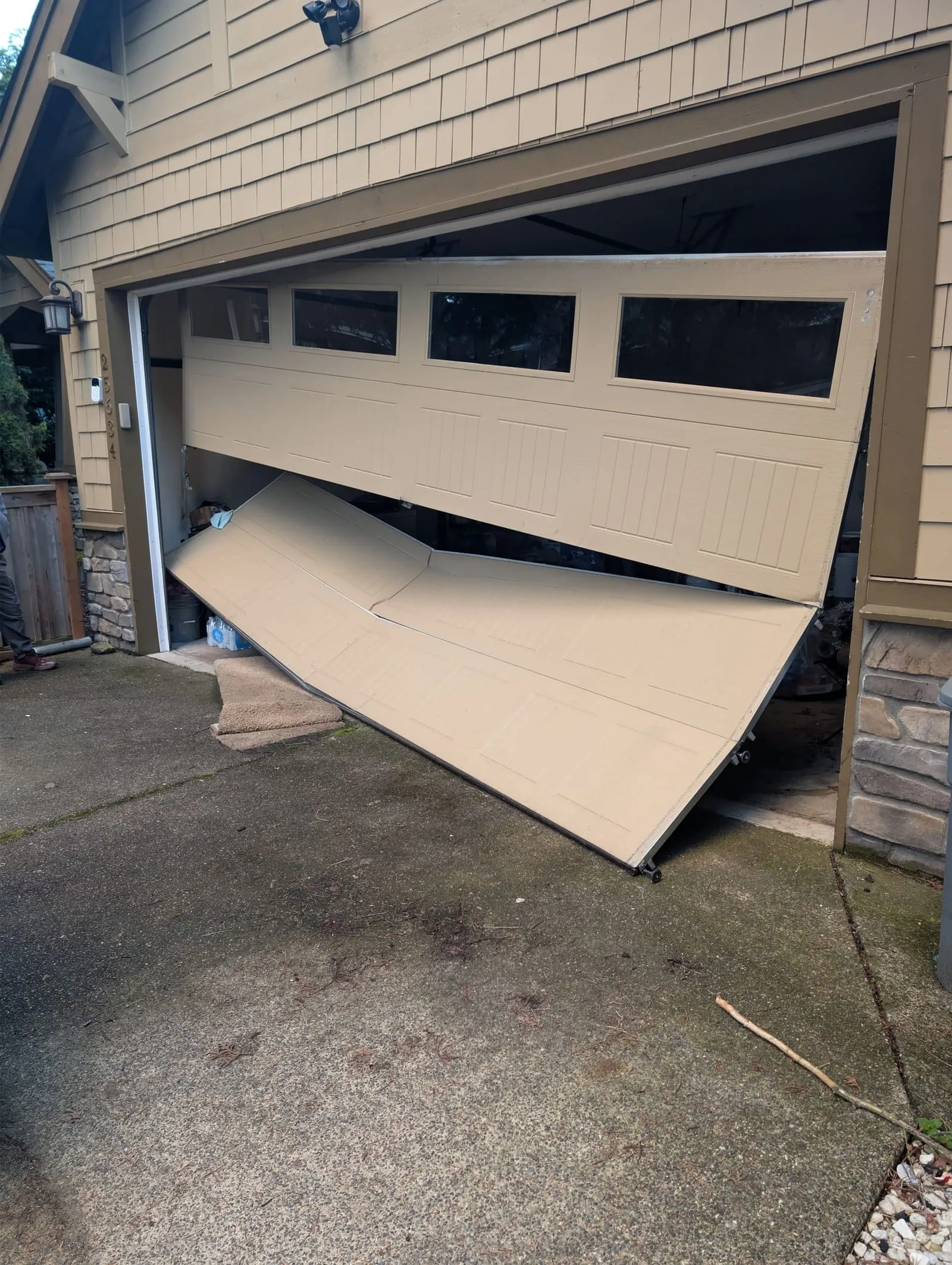 Emergency garage door repair — buckled door replaced same day in Seattle, WA