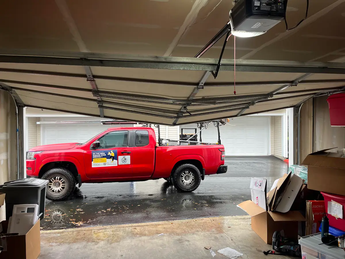 Northbridge Garage Door service truck parked outside an open garage during a repair call.