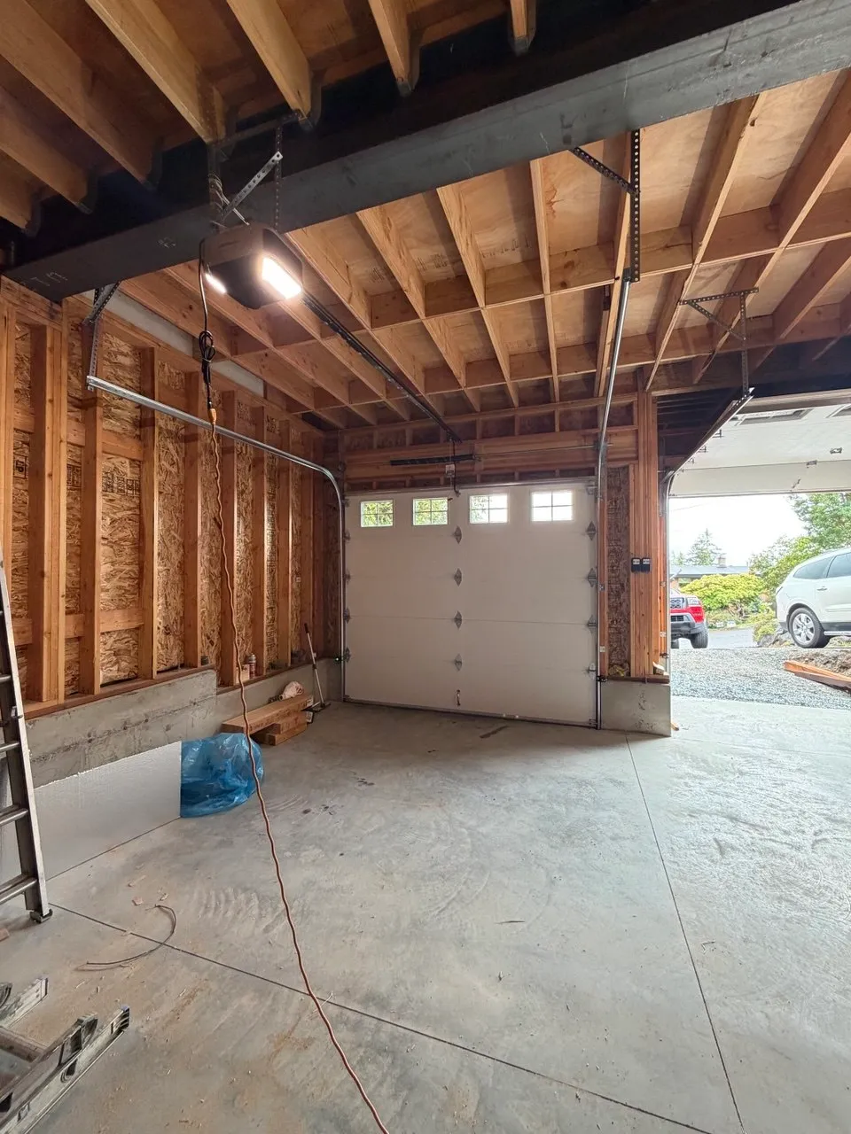 New garage door and opener installed inside the same Des Moines garage